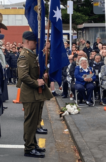 People sitting on steps wearing traditional Indian clothing.